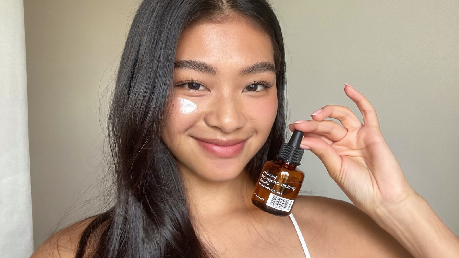 UGC creator reviewing a skincare serum for TikTok Shop